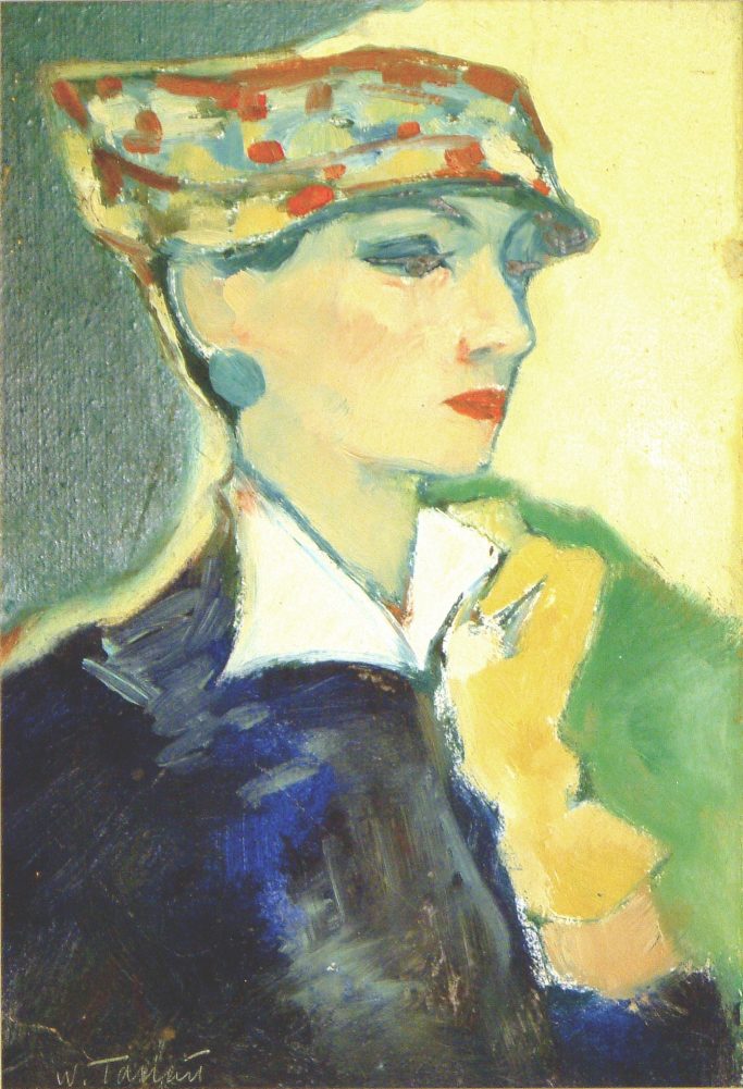 Freu mit bunter Kappe und gelbem Handschuh